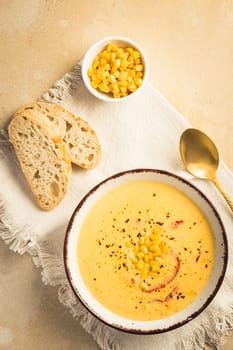 Delicious creamy chilli cheese corn soup served with bread