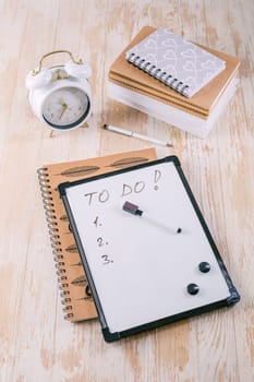 Time managament concept in office. Books, notepads with To-Do list
