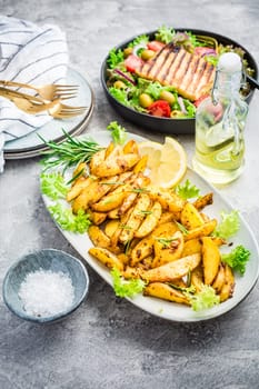 Potato wedges, oven roasted with freshly mixed salad and grilled cheese