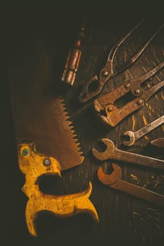 Collection of vintage carpentry tools on old workbench: woodworking, craftsmanship and handwork concept