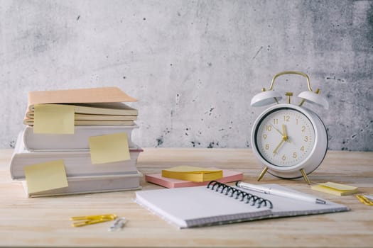 Concept of time management for office and school. Books, notepads with stickers