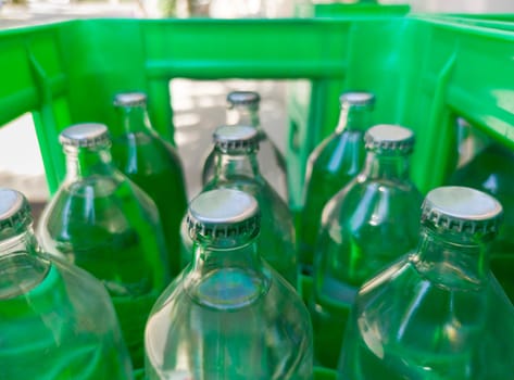 Glass bottled water on his box. Selective focus