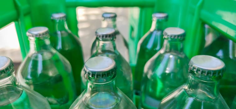 Glass bottled water on his box. Selective focus