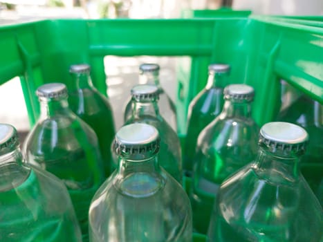 Glass bottled water on his box. Selective focus
