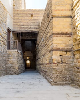 Exterior daylight shot of old abandoned stone bricks passage surrounding Sultan Qalawun Complex located in Al Moez Street, Cairo, Egypt