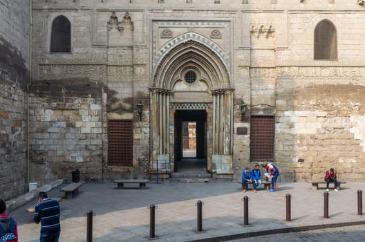 Cairo, Egypt- December 12 2015: Entrance of theological school and Mausoleum of Sultan Qalawun, Moez Street