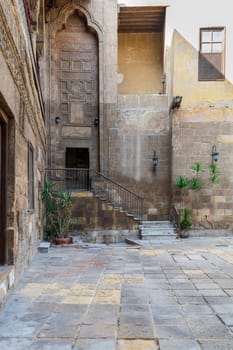 Courtyard of Prince Tax palace with staircase and entrance leading to the first floor located in Old Cairo, Egypt