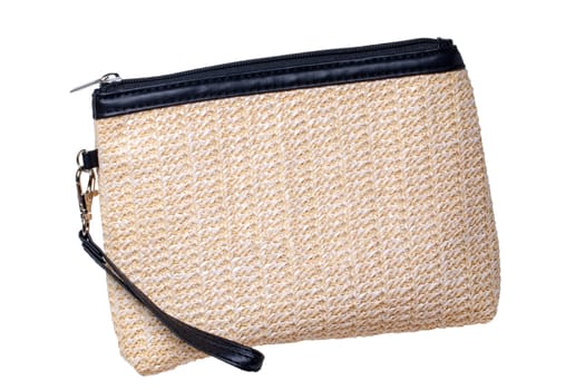 Cosmetic bags. Close-up of a beautiful beige with black leather cosmetic bag isolated on a white background. Macro. Used for essential equipment brushes for make-up and cosmetic products.