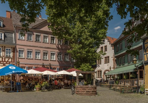 Restaurants with guests on the historic Schlossplatz in Frankfurt-Hoechst, germany