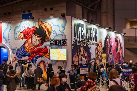 chiba, japan - december 22 2018: Crowd of people queuing along the  area dedicating to the manga One Piece decorated with the character of Monkey D. Luffy during the anime convention Jump Festa 19.
