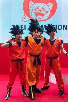 chiba, japan - december 22 2018: Three young men cosplayers wearing costume and wig of the character Son Goku of the manga and anime series of Dragon Ball during the convention Jump Festa 19.