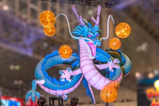 chiba, japan - december 22 2018: Huge inflatable structure depicting the dragon Shenron from the anime and manga serie of Dragon Ball floating under the ceiling of the anime convention Jump Festa 19.