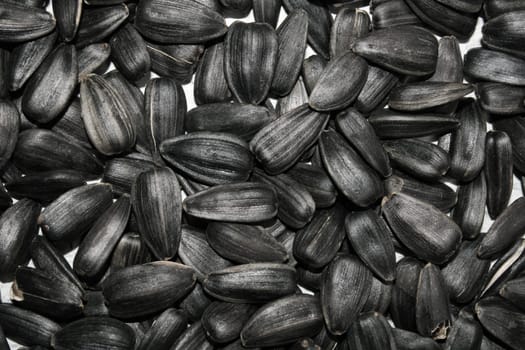 Black sunflower seeds close up. Background. The concept of agriculture, food, healthy lifestyle.