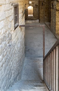 Exterior daylight shot of old abandoned stone bricks passage surrounding Sultan Qalawun Complex located in Al Moez Street, Cairo, Egypt