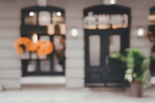 Blurred abstract image of window shop display or cafe with bokeh lights background