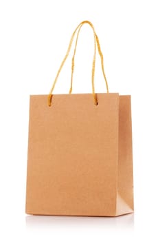 Blank shopping paper bags mockup. Empty cardboard craft bag on a white background. Consumer pack ready for logo design. Shopping and gifts concept.