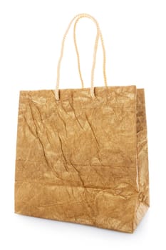 Blank brown nacre gift bag with raised handles. Package is made of crepe paper. Consumer pack ready for logo design. Advertising and branding. Isolated on a white background.