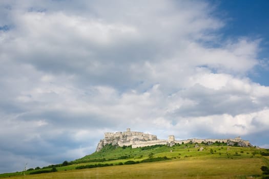 Spis Castle at sunny day with picturesque clouds, Slovakia. UNESCO World Heritage site.