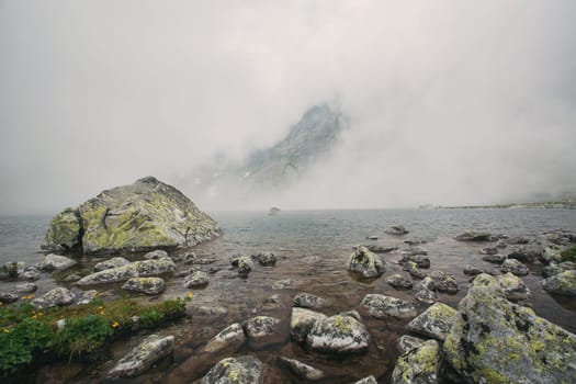 Mountain lake Hincovo pleso in High Tatras. Mountain lake Hincovo pleso in High Tatras. Slovakia. Natural misty landscape.