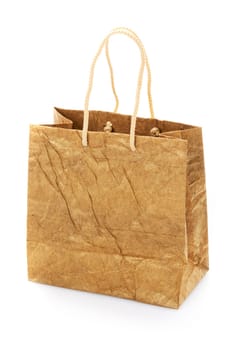 Blank brown nacre gift bag with raised handles. Package is made of crepe paper. Consumer pack ready for logo design. Advertising and branding. Isolated on a white background.