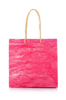 Pink nacre gift bag with raised handles. Package is made of crepe paper. Consumer pack ready for logo design. Advertising and branding. Isolated on a white background.