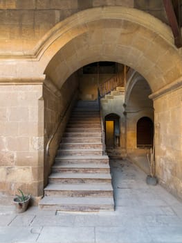 Exterior daylight shot of staircase going up leading to Caravansary - Wikala - of Bazaraa, suited in Gamalia district, Medieval Cairo, Egypt