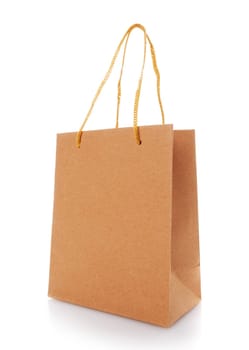 Blank shopping paper bags mockup. Empty cardboard craft bag on a white background. Consumer pack ready for logo design. Shopping and gifts concept. Side view.