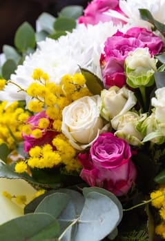 Nature background. Close up of a bright colored floral arrangement consisting of different flowers. Concept of floral arrangements for greetings.