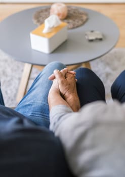 Happy romantic senior couple in love holding hands at home