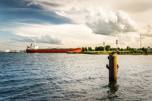 A maritime vessel is entering the Kiel Canal from the Baltic Sea. The Kiel Canal links the Baltic Sea with the North Sea