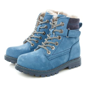 Side view of winter children's warm blue boots with fur for walking. White background.