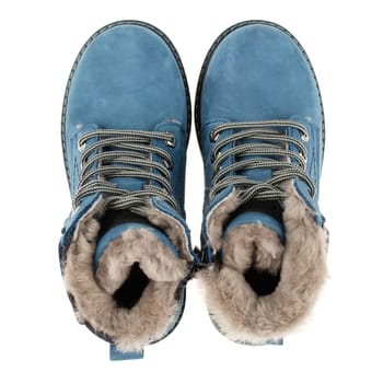 Top view of casual children's warm blue boots with fur on a white background. Macro photo.