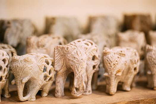 Goa, India. Elephants Souvenirs Of Stone On Shelf In Store. Goods For Tourists.