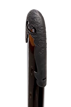 'Kojiri' is the end of the Japanese sword's scabbard or the protective fitting at the end of the scabbard. Normally made by horn but in this picture is metal. Isolated in white Background.