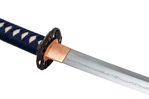 The habaki (collar) is made of polished copper. It is at the base of a Japanese sword blade with a wavy pattern on the sharp part. isolated on a white background. Selective focus.