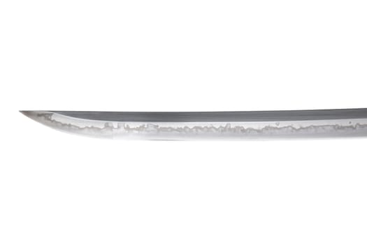 Japanese sword blade (made in China) on white background. Soft focus. The wavy pattern on the blade edge is a line of hardness that a blacksmith makes so that the blade doesn't break.