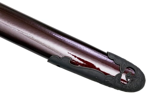 'Kojiri' is the end of the Japanese sword's scabbard or the protective fitting at the end of the scabbard. Normally made by horn but in this picture is metal. Isolated in white Background.