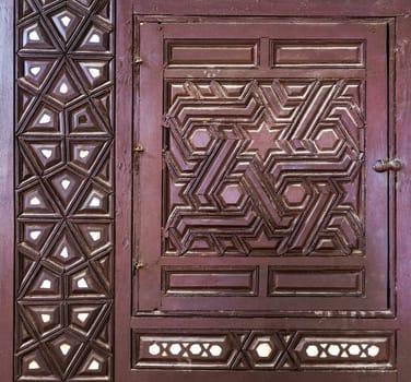 Single arabesque sash of an old ottoman era style built-in cupboard with geometrical engraved decorations inlaid with ivory, Rosetta City, Egypt