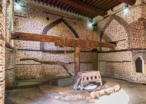Ancient rotary Flour Mill used to be rotated by animal power, known as Abu Shaheen Mill with black and red bricks wall, located next to El Amasely historic house, Rosetta city, Egypt