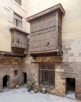 Facade of ottoman era historic house of El Sehemy with wooden oriel windows - Mashrabiya - located at Moez Street, Medieval Cairo, Egypt