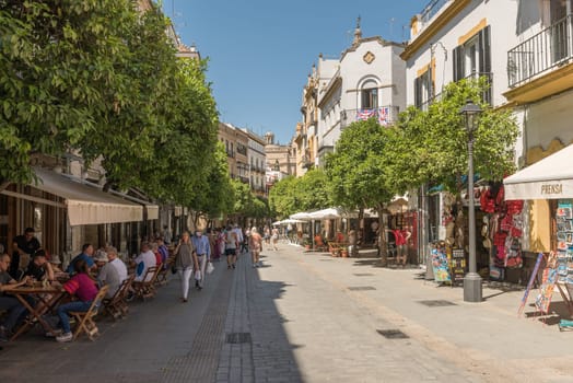small narrow street in the historic old town of Seville, Spain