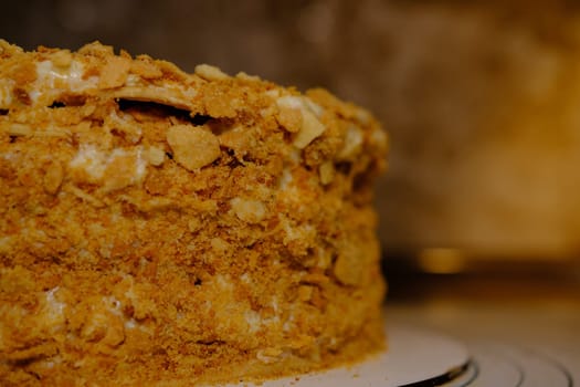 Board with delicious Napoleon cake, close up with selective blur.