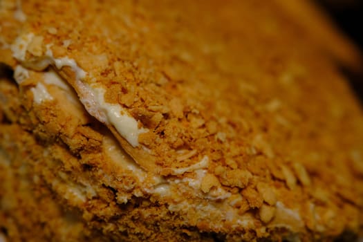 Board with delicious Napoleon cake, close up with selective blur.