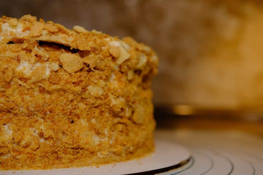 Board with delicious Napoleon cake, close up with selective blur.