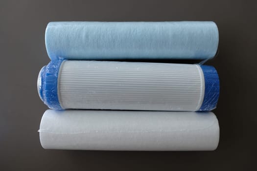 cartridges for water filter isolated on grey.