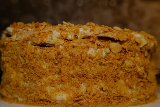 Board with delicious Napoleon cake, close up with selective blur.