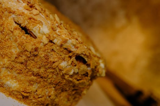 Board with delicious Napoleon cake, close up with selective blur.