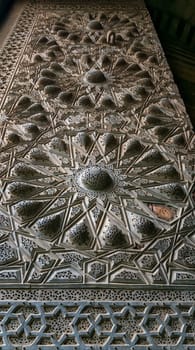 Geometrical engraved bronze-plate decorations of the main entrance of public ancient mosque of Sultan Al Moaayad, Old Cairo, Egypt