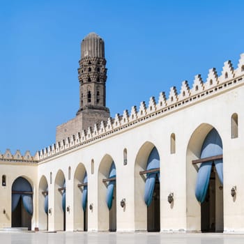 Minaret of public historic Al Hakim Mosque known as The Enlightened Mosque, located in Moez Street, south of the old door of old Cairo gate named Bab Al-Futuh, Egypt