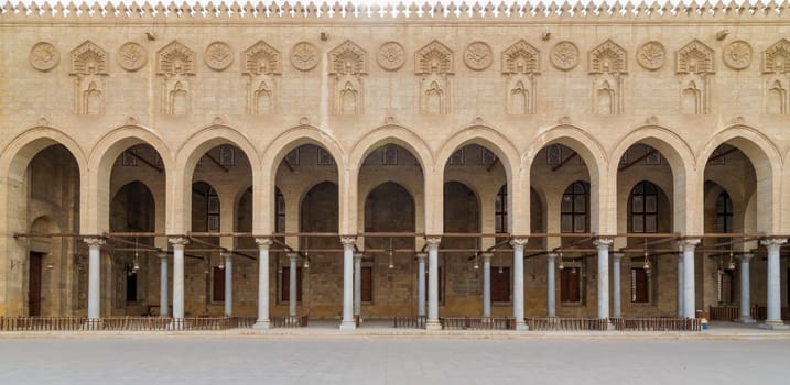Arched corridor surrounding the courtyard of public ancient mosque of Sultan Al Moaayad, Old Cairo, Egypt